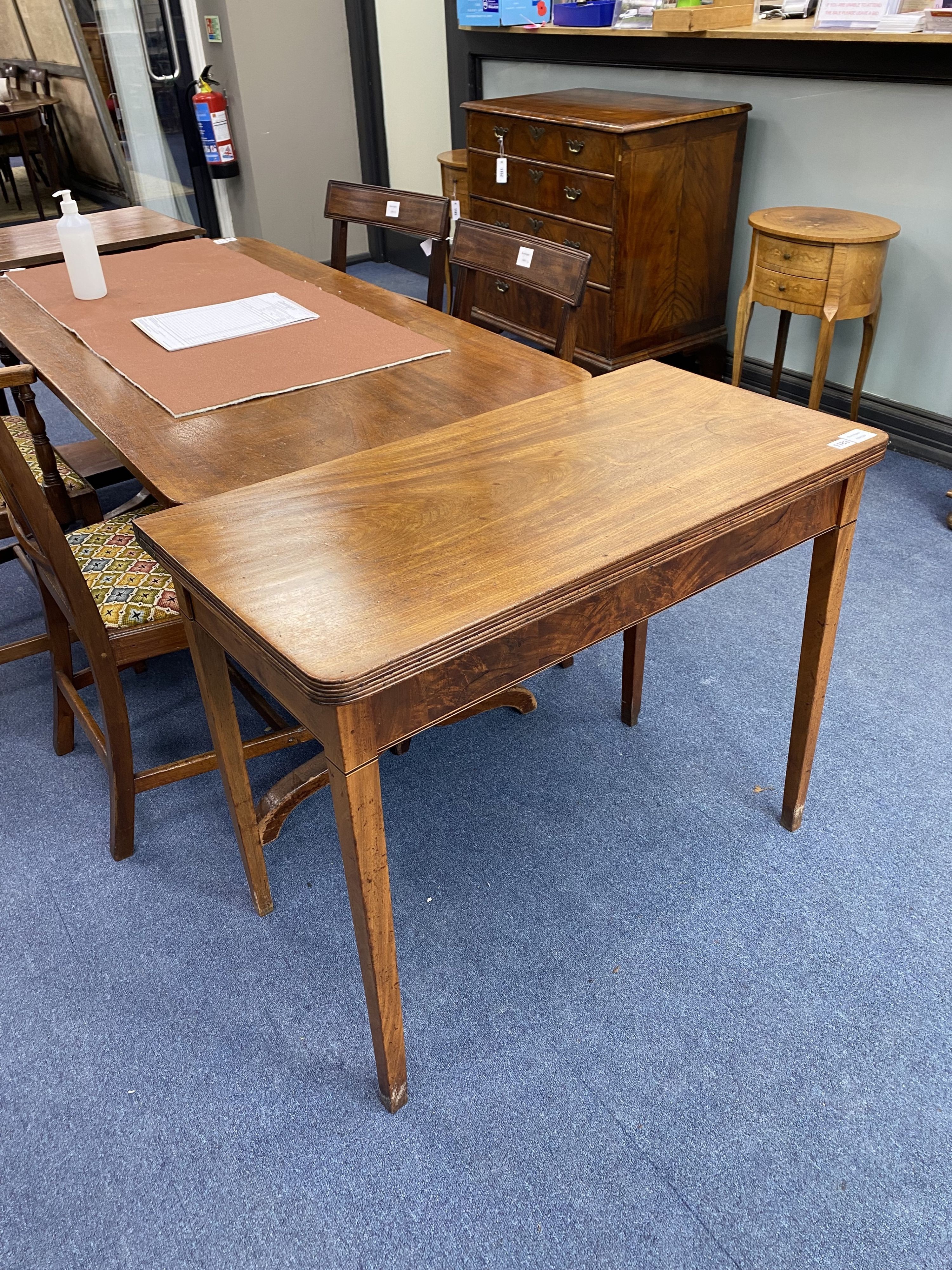 A George III mahogany folding tea table, width 88cm, depth 45cm, height 71cm